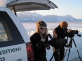 Guests use spotting scopes to view wildlife.